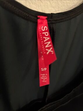 SPANX black shapewear with red tag
